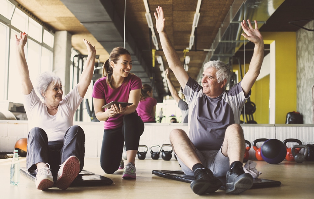 Older adults exercising with a trainer