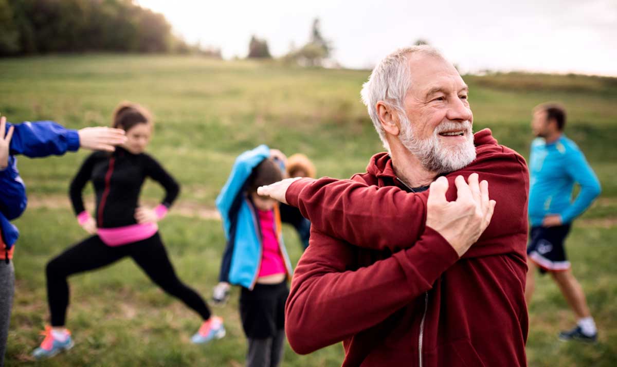 Group of older adults stretching and exercising