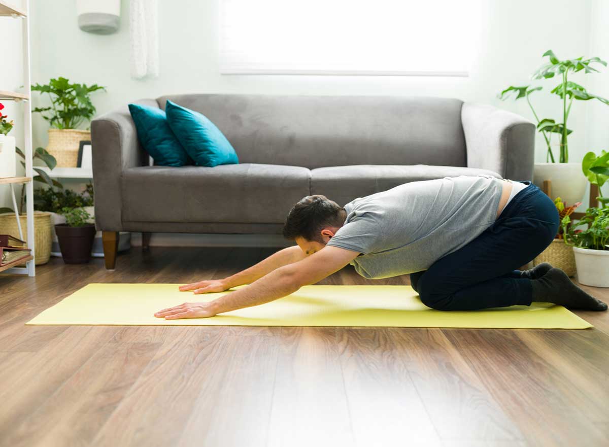 Man doing child's pose