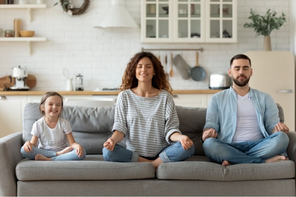 Family practicing meditation