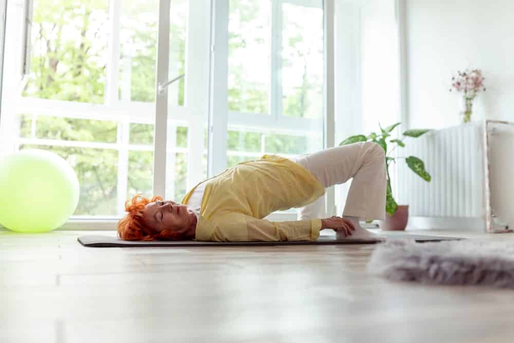 Active senior woman stretching