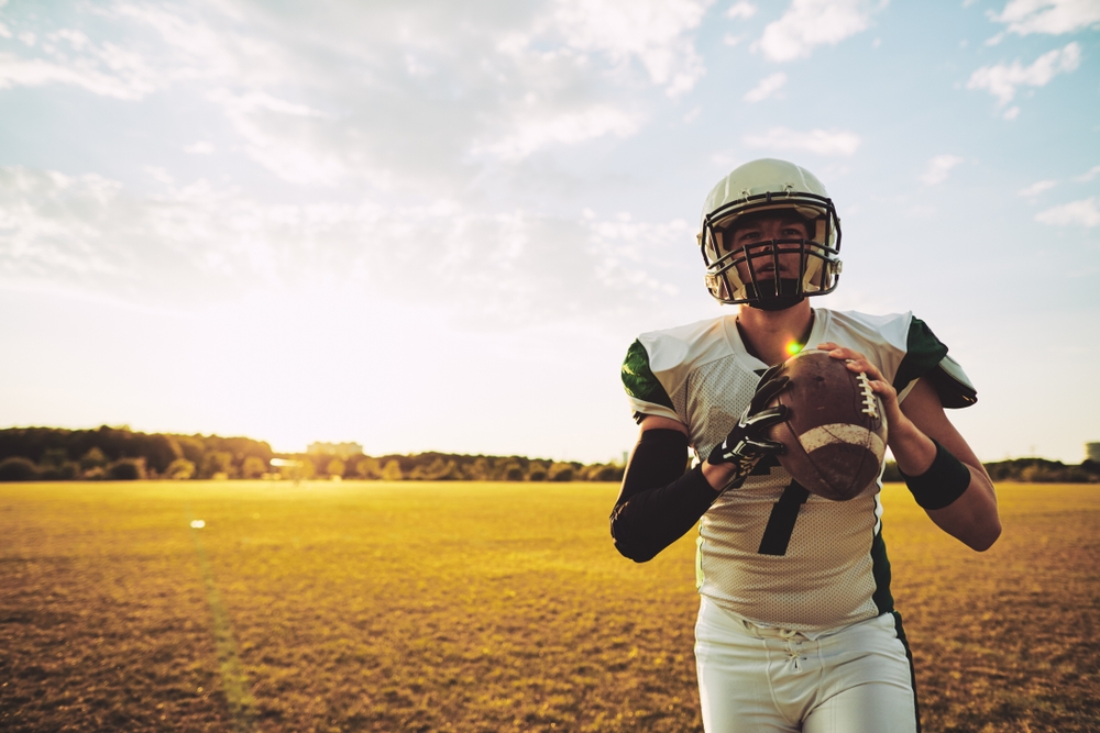 Quarterback holding football